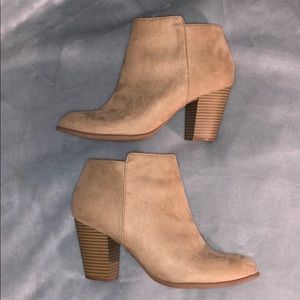 Tan boots with a 3 inch heel.